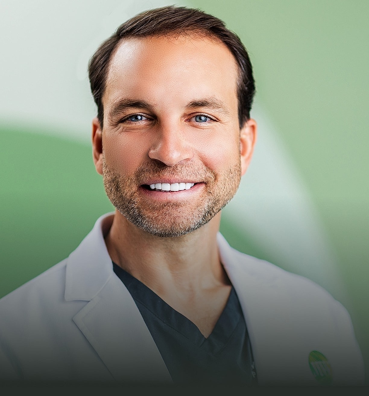 Smiling doctor in a medical setting.