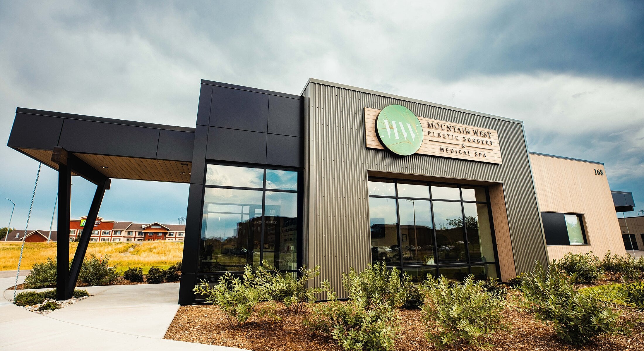 Modern medical spa building with signage.