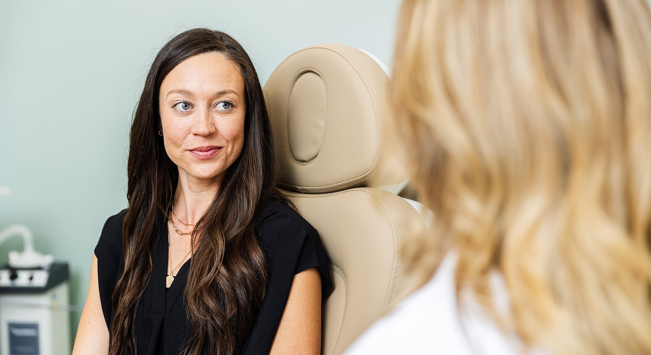 Patient discussing treatment in a medical setting.