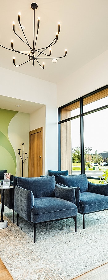 Modern living space with stylish blue chairs