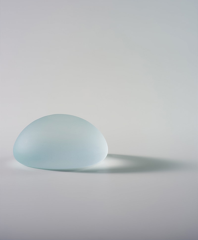Frosted glass object with soft shadows.
